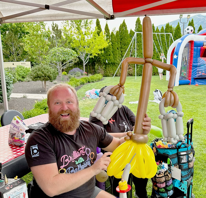 Balloon broom sculpture made for an event guest