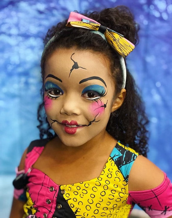 Festival face painting example with detailed line work