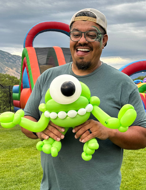 Happy alien balloon twisting character